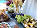 Olives and antipasto are presented on marble slabs for a cocktail hour at a Tuscan style wedding