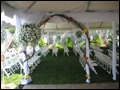 tent decorated with real flowers and tulle for an off site wedding on long island