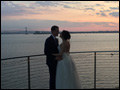 bride and groom at the sunset on Long Island as their wedding is winding down