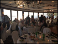 Wedding guests enjoying good food and conversation at a catered Long Island wedding at The Merchant Marine Academy