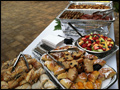catered breakfast buffet with mini pastries, muffins and fresh fruit