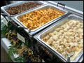 catered buffet line with portabella chicken, penne vodka and chicken meatballs in gorgonzola sauce