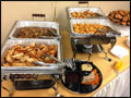 chafing dishes with catered appetizers at a corporate event
