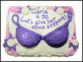funny birthday cake with whipped cream frosting, flowers and a purple bra with let's give her some support message