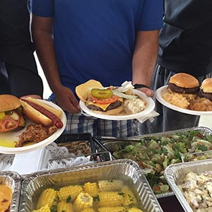 three plates of freshly served felicos BBQ food