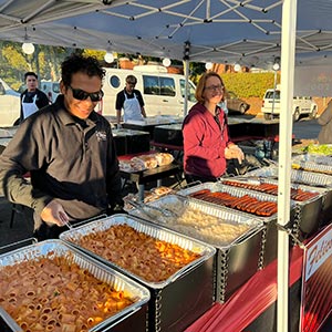 felicos staff ready to serve at an outdoor BBQ