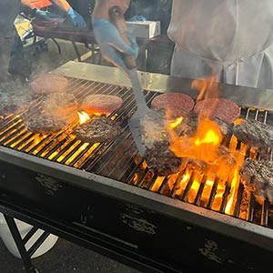 A vibrant fire BBQ grill with flames dancing, ready for a delicious outdoor cookout.