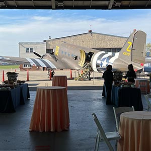 wedding set up with airplane scenery in the background