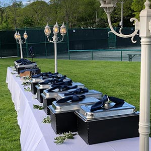chafing dishes at an outdoor wedding set up