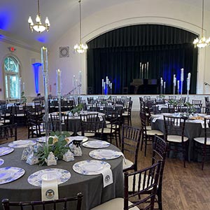 A picturesque catered wedding setting featuring beautifully arranged tables, at The Mariner Estate