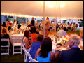 Long Island wedding party at a lit party tent