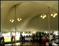 domed wedding tent lit with chandeliers for a catered Long Island wedding