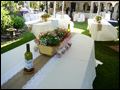 tables set in white linens for a Tuscan style catered wedding