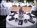 li wedding catering in a white party tent with a black astro turf floor and wooden dance floor