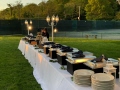 sun is setting over a buffet line at a Long Island wedding