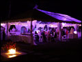 beautiful Long Island backyard wedding at dusk with a lit bonfire