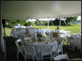 backyard wedding catering tables dressed in white with burlap runners