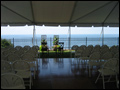 long island back yard wedding in a tent with dance floor and table for the bride and groom